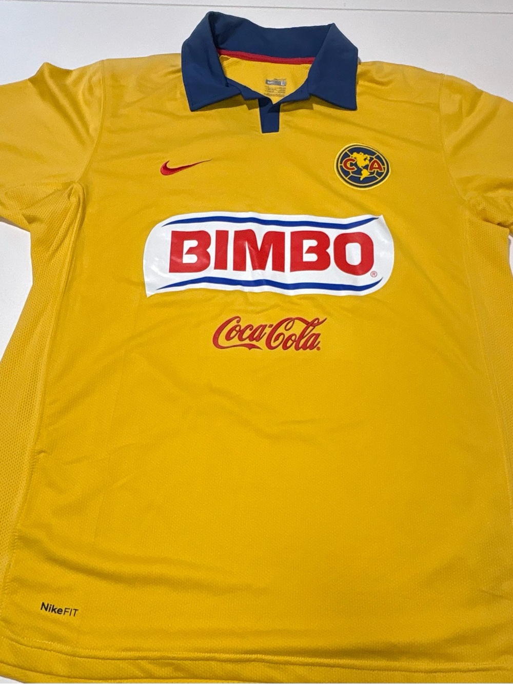 Nike Yellow Soccer Jersey with Navy Collar and Red Accents